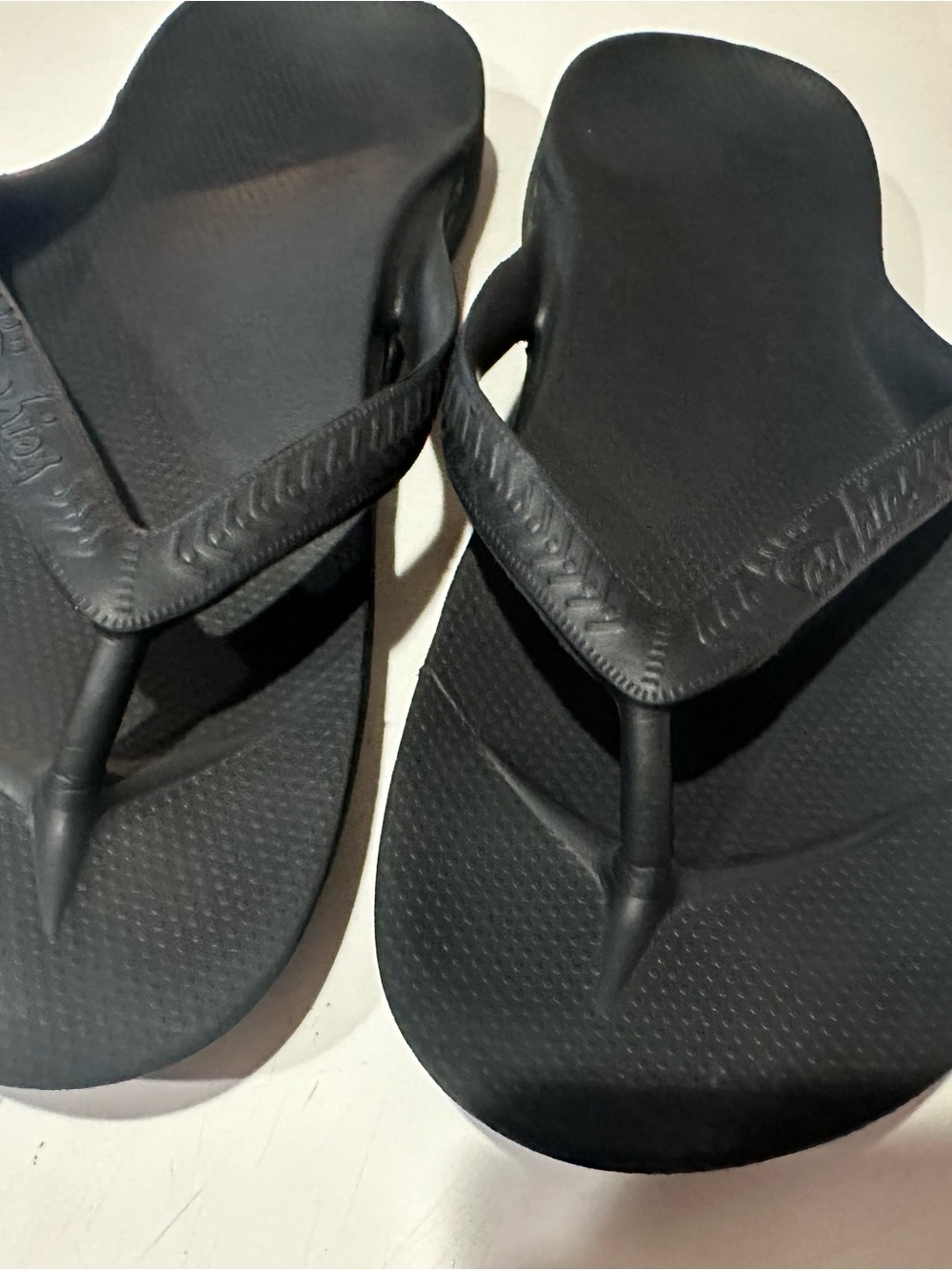 Archie’s Black Flip Flops